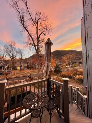 a view of a balcony with furniture