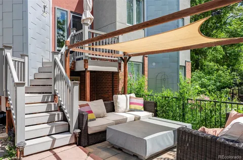 a view of a patio with couches table and chairs