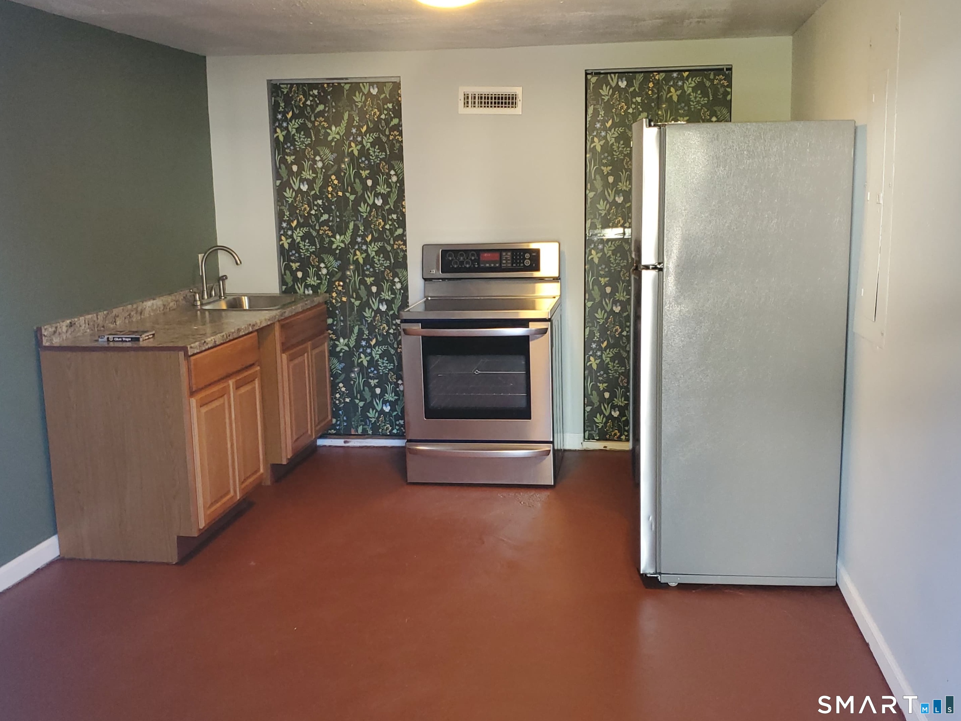 118 Pullen Avenue Watertown, CT 06779 - Photo 7 of 8 a kitchen with stainless steel appliances a refrigerator and a stove