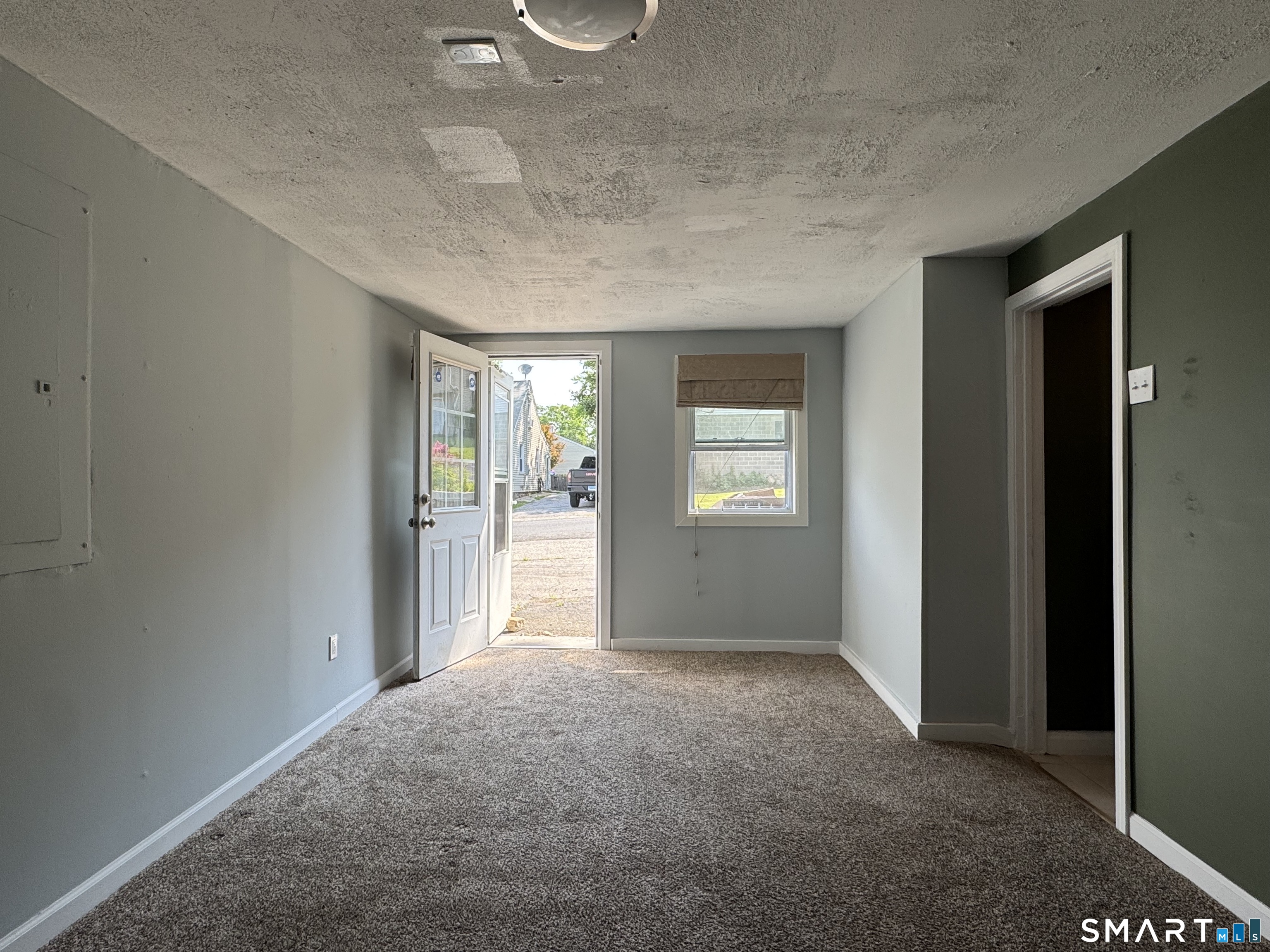 118 Pullen Avenue Watertown, CT 06779 - Photo 8 of 8 a view of a big room with windows and closet