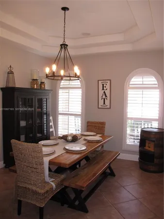 a kitchen with granite countertop a sink and a window