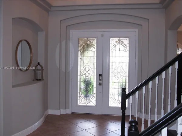 a view of entryway with a front door