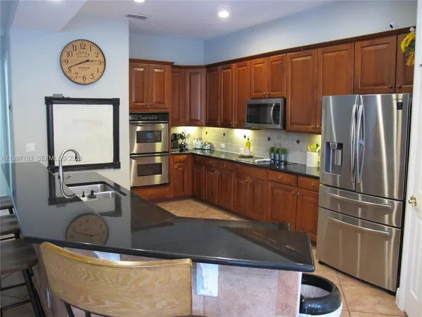 a bedroom with a bed and a mirror