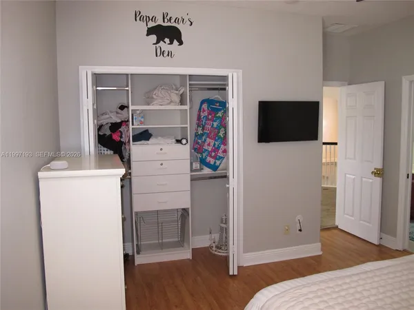 a view of a field with a trees in the background