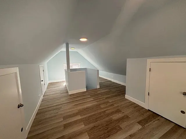 a view of a room with wooden floor and staircase