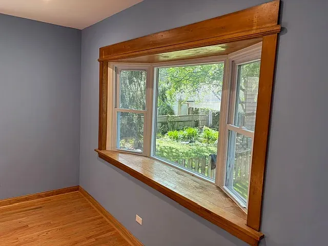 a view of a room that has a large window