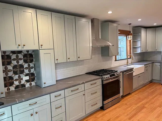 a kitchen with granite countertop cabinets and stainless steel appliances