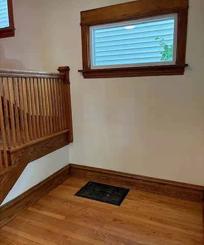 a view of wooden floor in an empty room