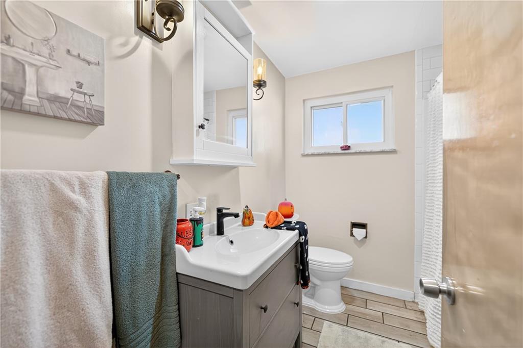 717 Mercer Road Beaver Falls, PA 15010 - Photo 12 of 22 a bathroom with a sink toilet and shower