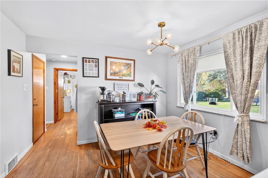 717 Mercer Road Beaver Falls, PA 15010 - Photo 5 of 22 a view of a dining room with furniture window and wooden floor