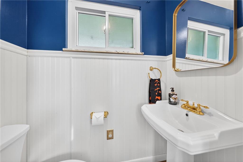 717 Mercer Road Beaver Falls, PA 15010 - Photo 9 of 22 a bathroom with a sink and a mirror