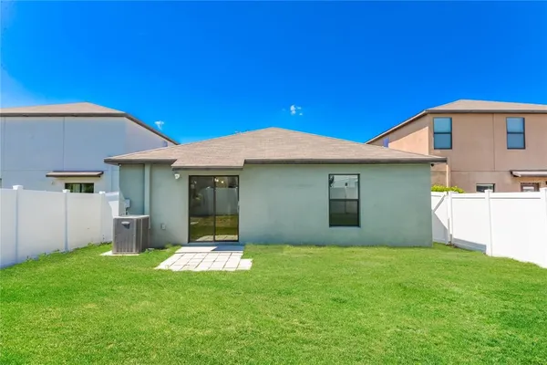 a view of a house with a yard and garage