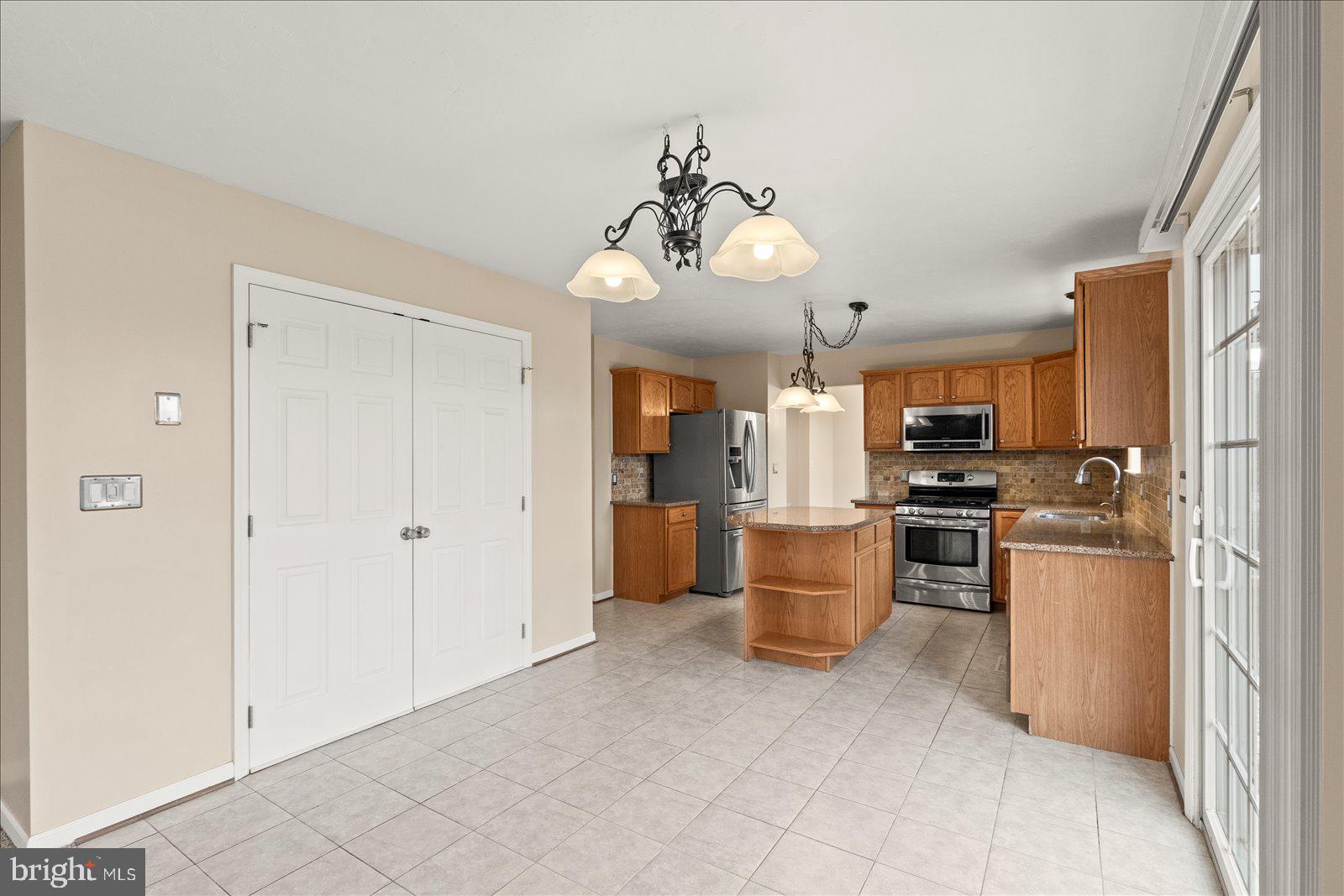 6475 Pamadeva Road Hanover, PA 17331 - Photo 13 of 47 a view of a kitchen with refrigerator and cabinets