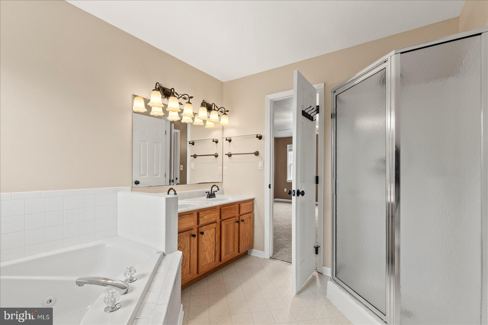 6475 Pamadeva Road Hanover, PA 17331 - Photo 21 of 47 a bathroom with a tub sink shower and mirror