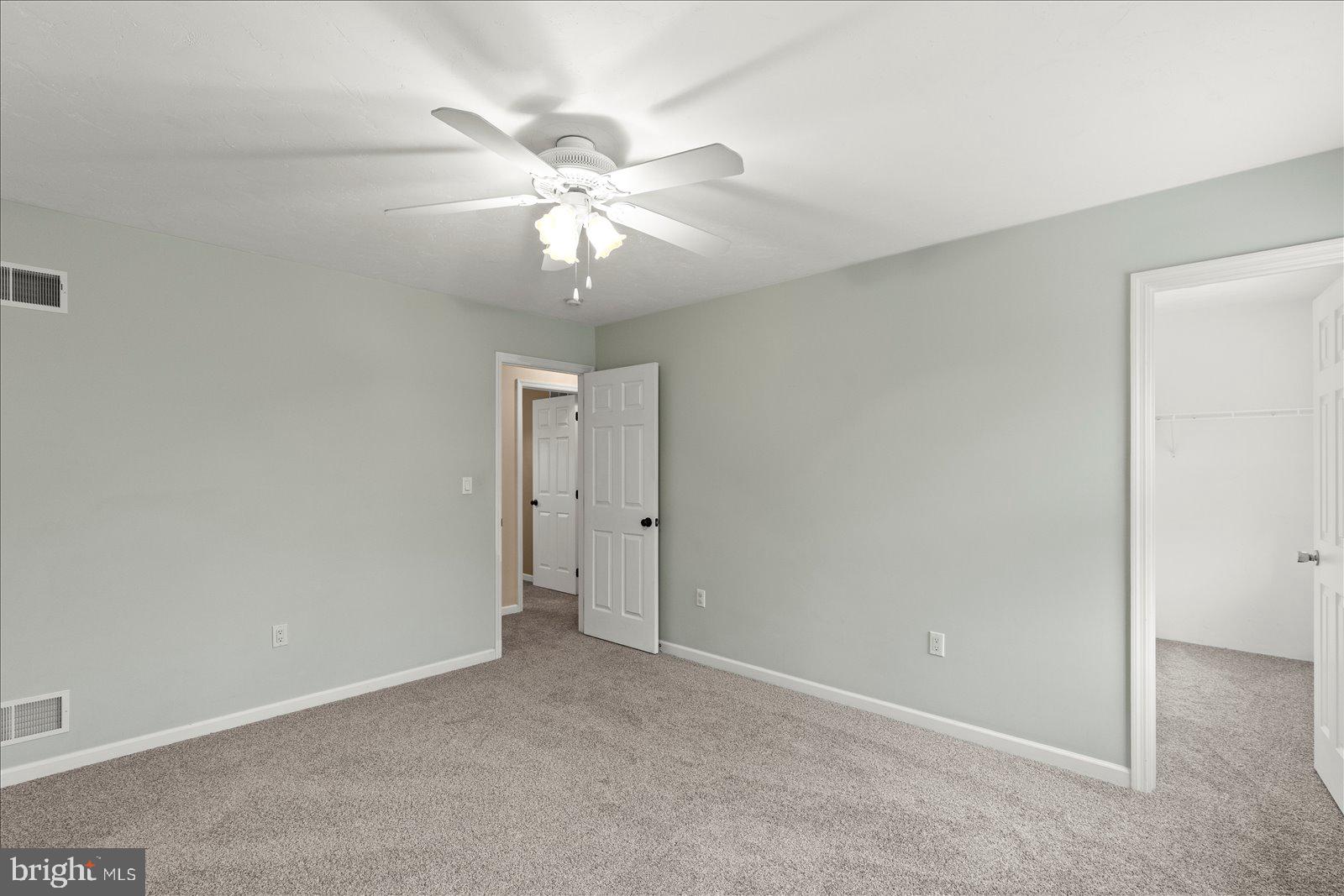 6475 Pamadeva Road Hanover, PA 17331 - Photo 23 of 47 an empty room with a chandelier fan and a chandelier fan