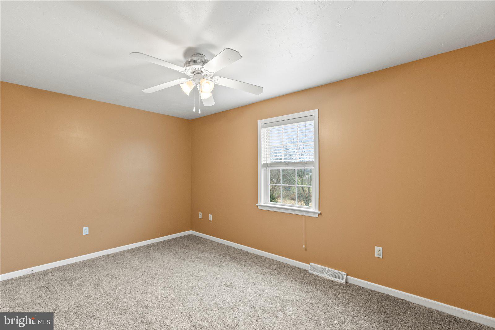 6475 Pamadeva Road Hanover, PA 17331 - Photo 24 of 47 an empty room with a window and a fan