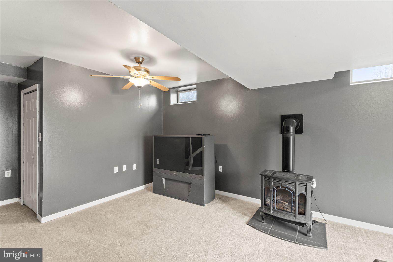 6475 Pamadeva Road Hanover, PA 17331 - Photo 29 of 47 a room with a chandelier and a flat screen tv