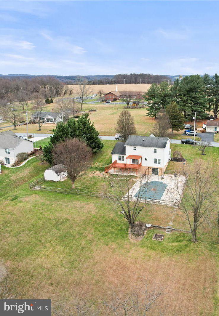 6475 Pamadeva Road Hanover, PA 17331 - Photo 4 of 47 a view of a lake with lawn chairs