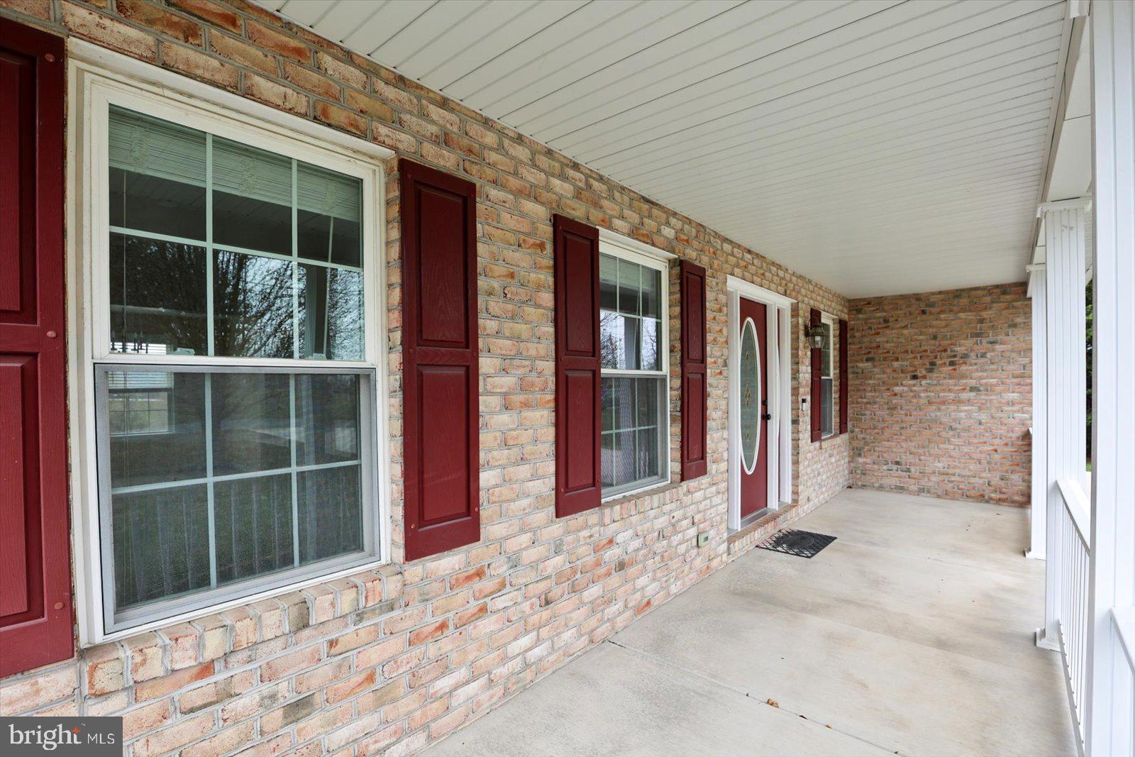 6475 Pamadeva Road Hanover, PA 17331 - Photo 6 of 47 a view of a house with a large window and plants