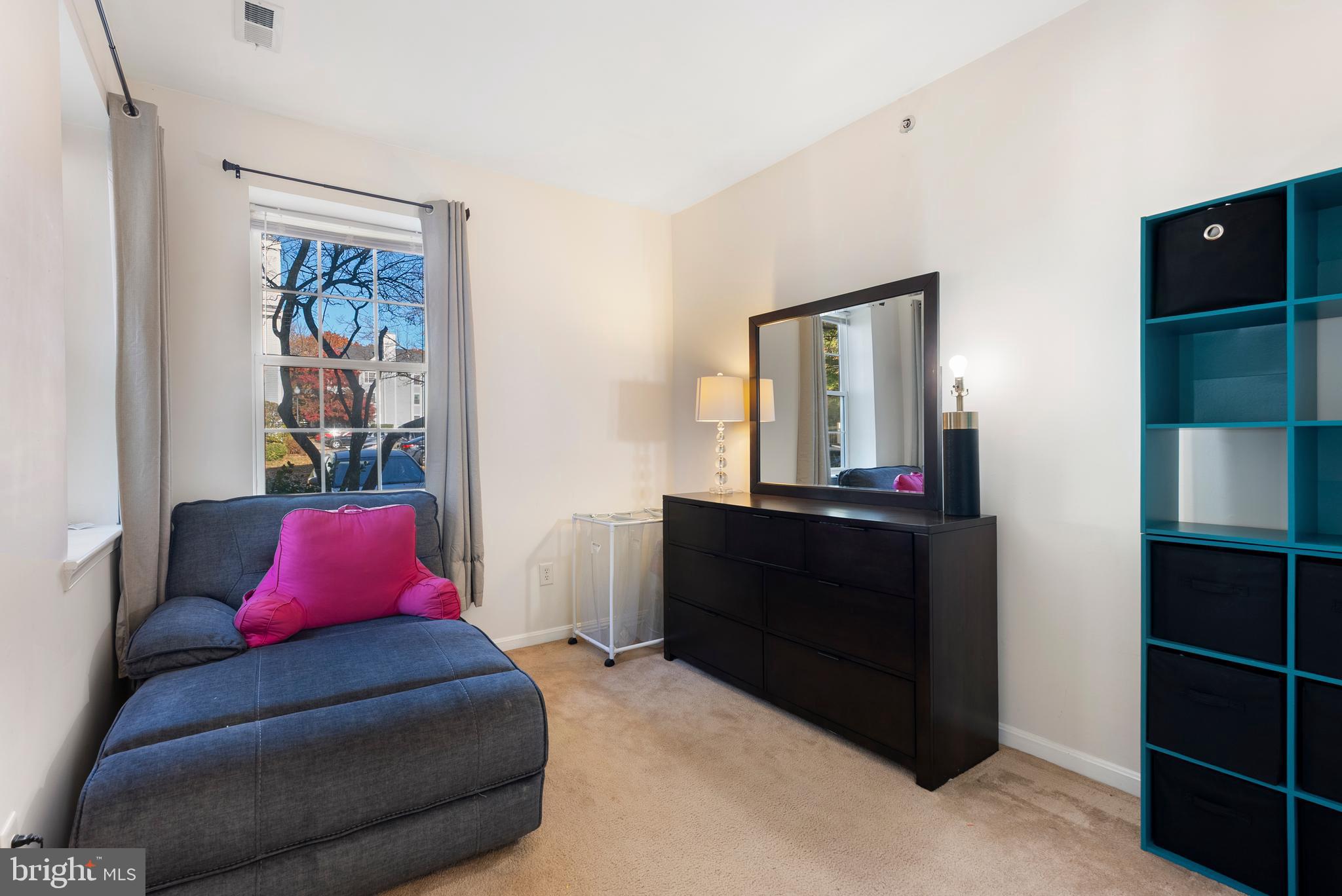 606 Moonglow Road, Unit 103 Odenton, MD 21113 - Photo 12 of 15 a living room with a bed and dresser