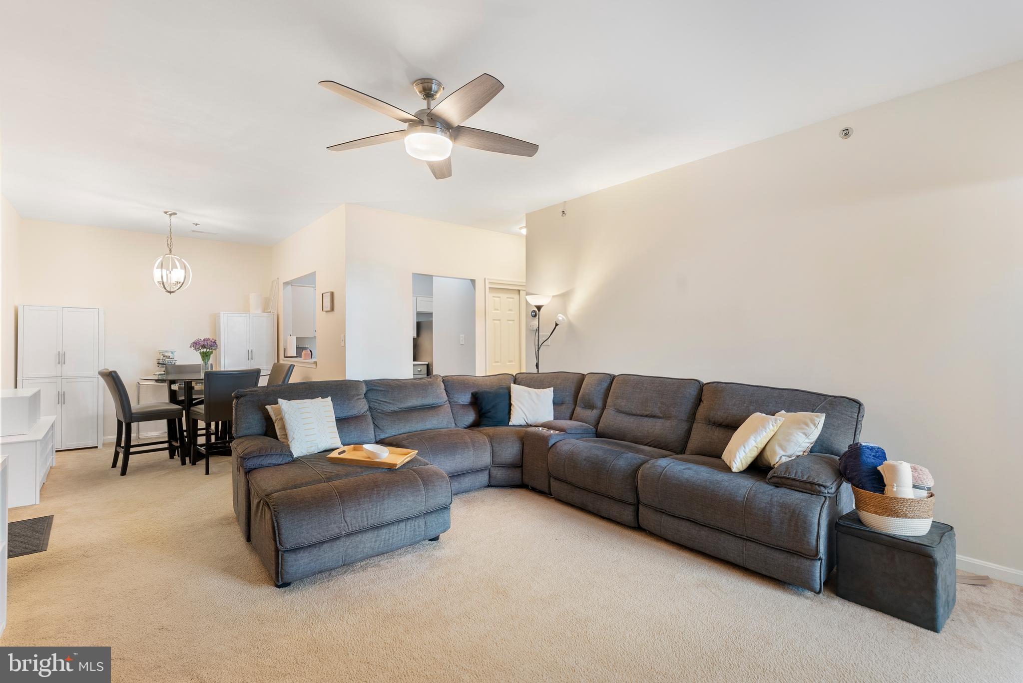 606 Moonglow Road, Unit 103 Odenton, MD 21113 - Photo 2 of 15 a living room with furniture and a ceiling fan