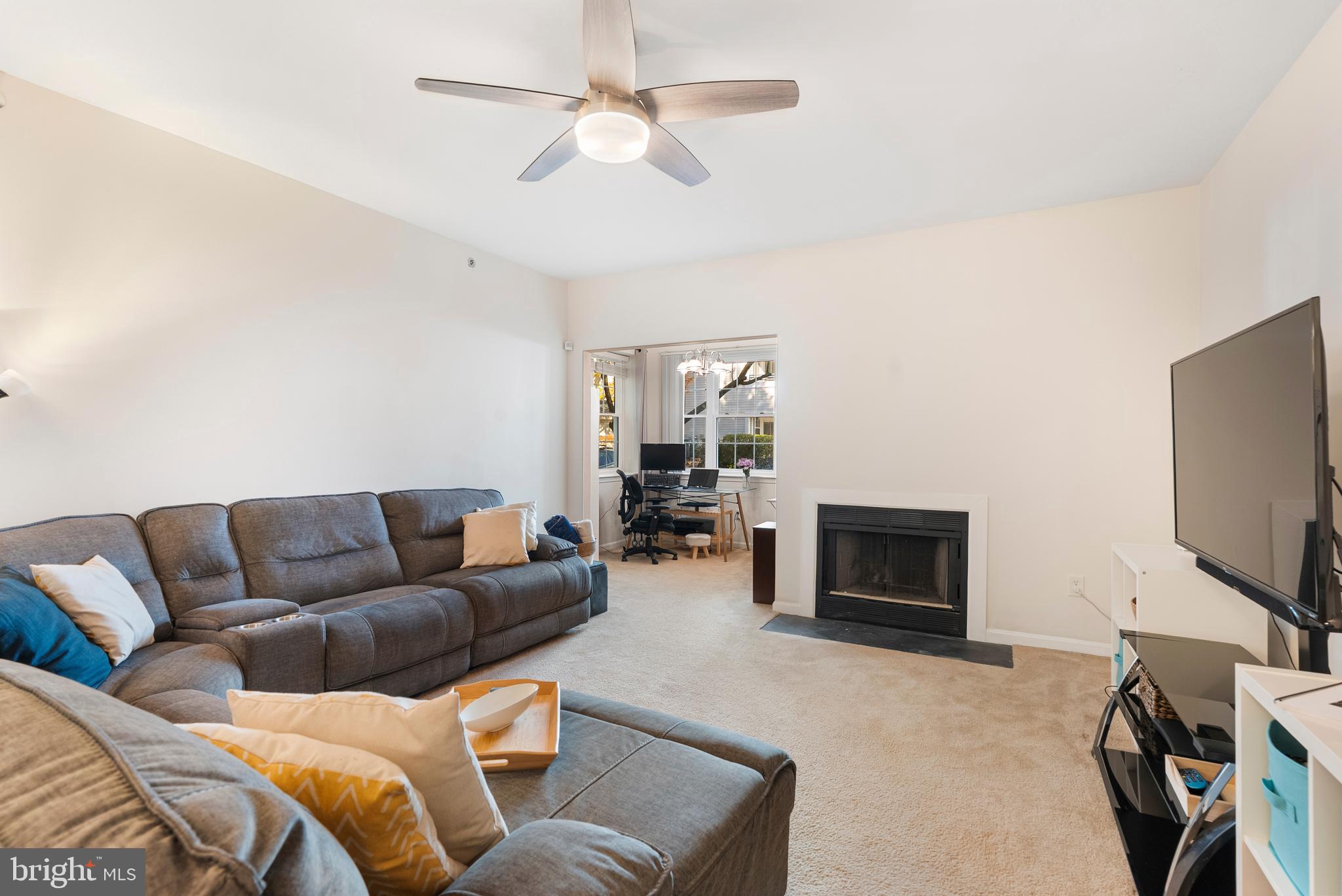 606 Moonglow Road, Unit 103 Odenton, MD 21113 - Photo 3 of 15 a living room with furniture and a flat screen tv