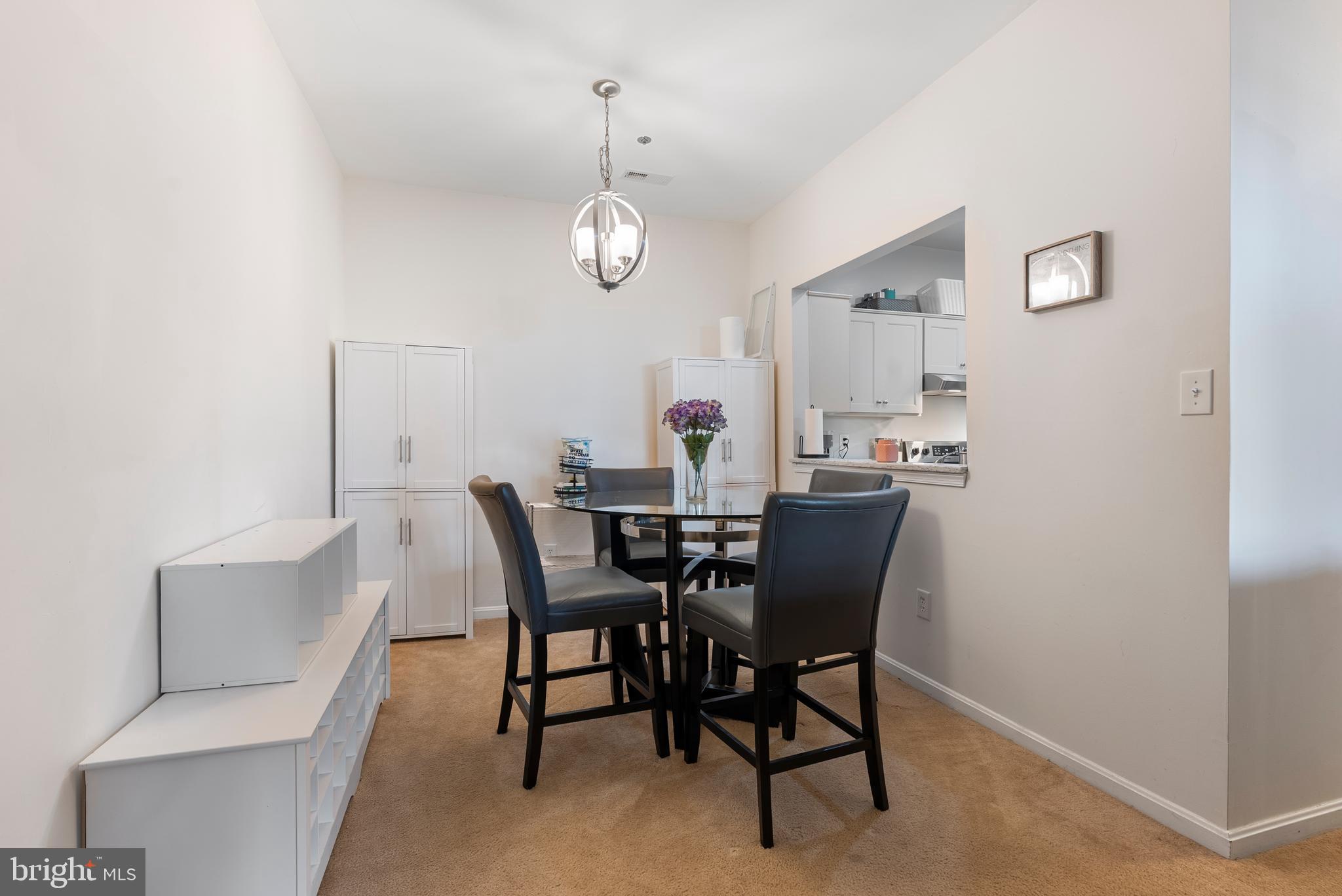 606 Moonglow Road, Unit 103 Odenton, MD 21113 - Photo 6 of 15 a view of a dining room with furniture