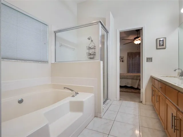 a bathroom with a bathtub and a sink