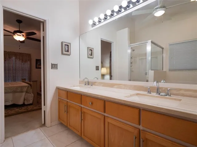 a en suite bathroom with double sink and a mirror