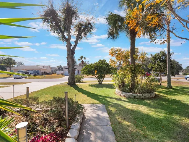 a view of a lake with a yard