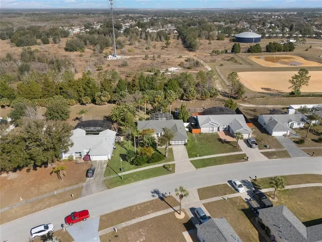 an aerial view of a house with outdoor space