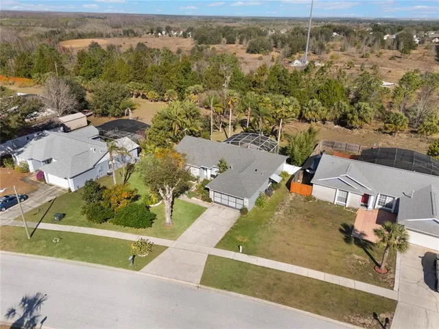 an aerial view of residential houses with city view