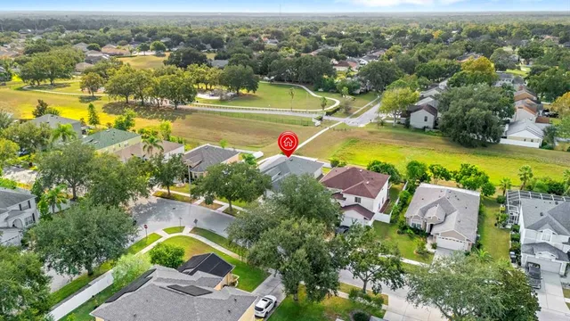an aerial view of a house with a swimming pool yard and outdoor seating