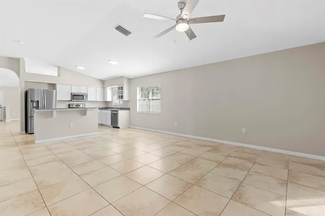 a view of a kitchen with a sink and a window