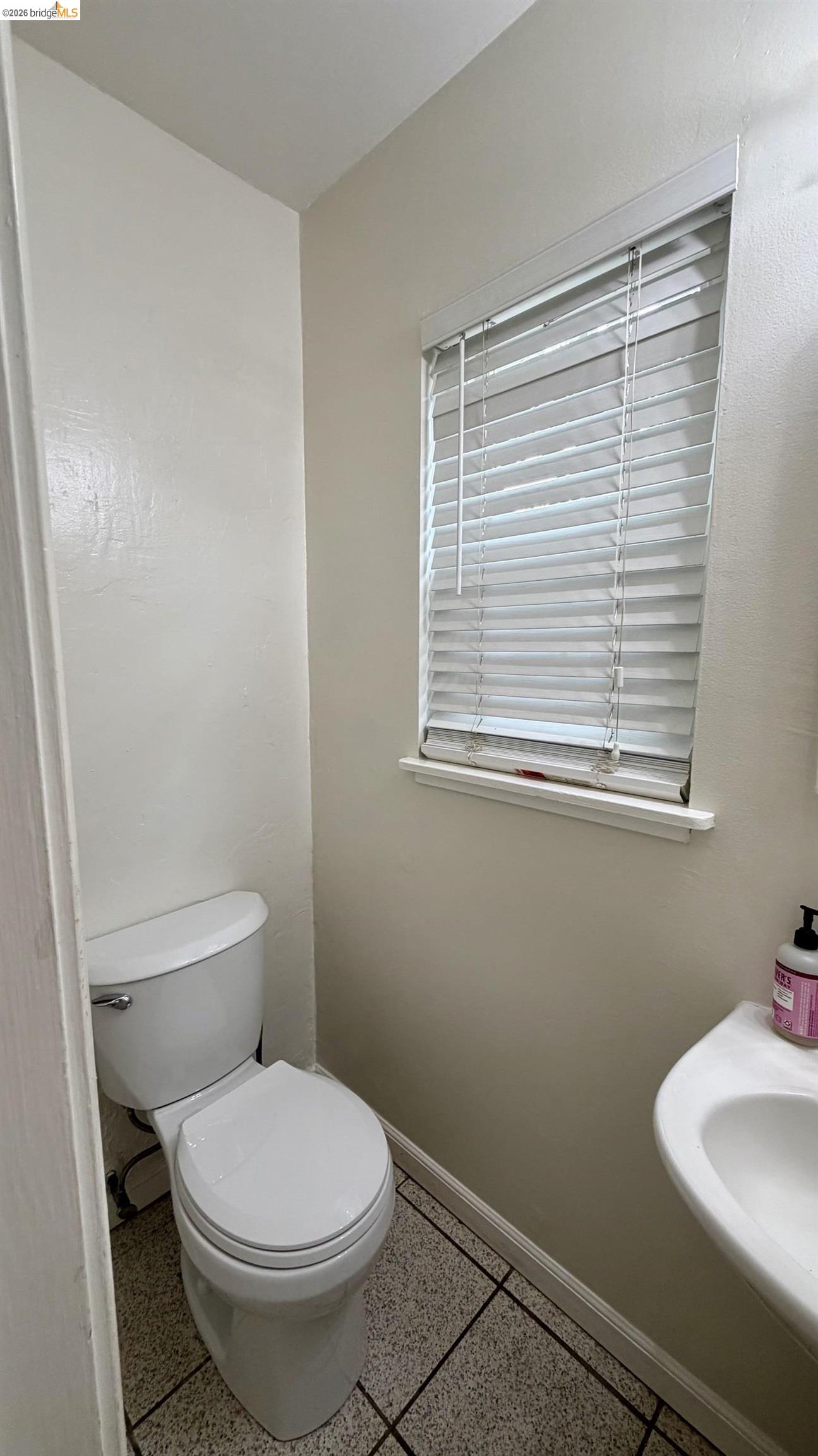 3407 Cowell Road Concord, CA 94518 - Photo 18 of 24 Bathroom featuring baseboards and dark aggregate flooring