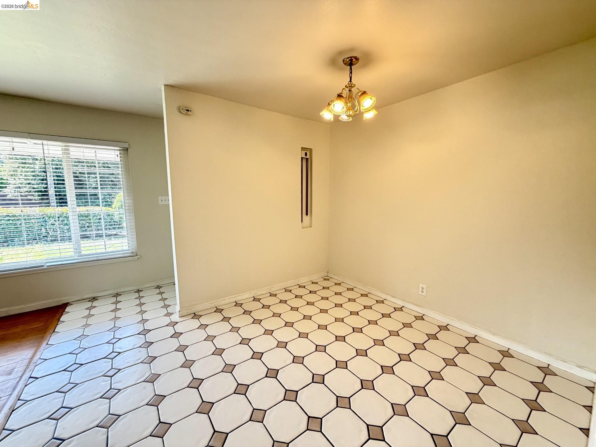 3407 Cowell Road Concord, CA 94518 - Photo 3 of 24 Spare room with hanging lights and baseboards