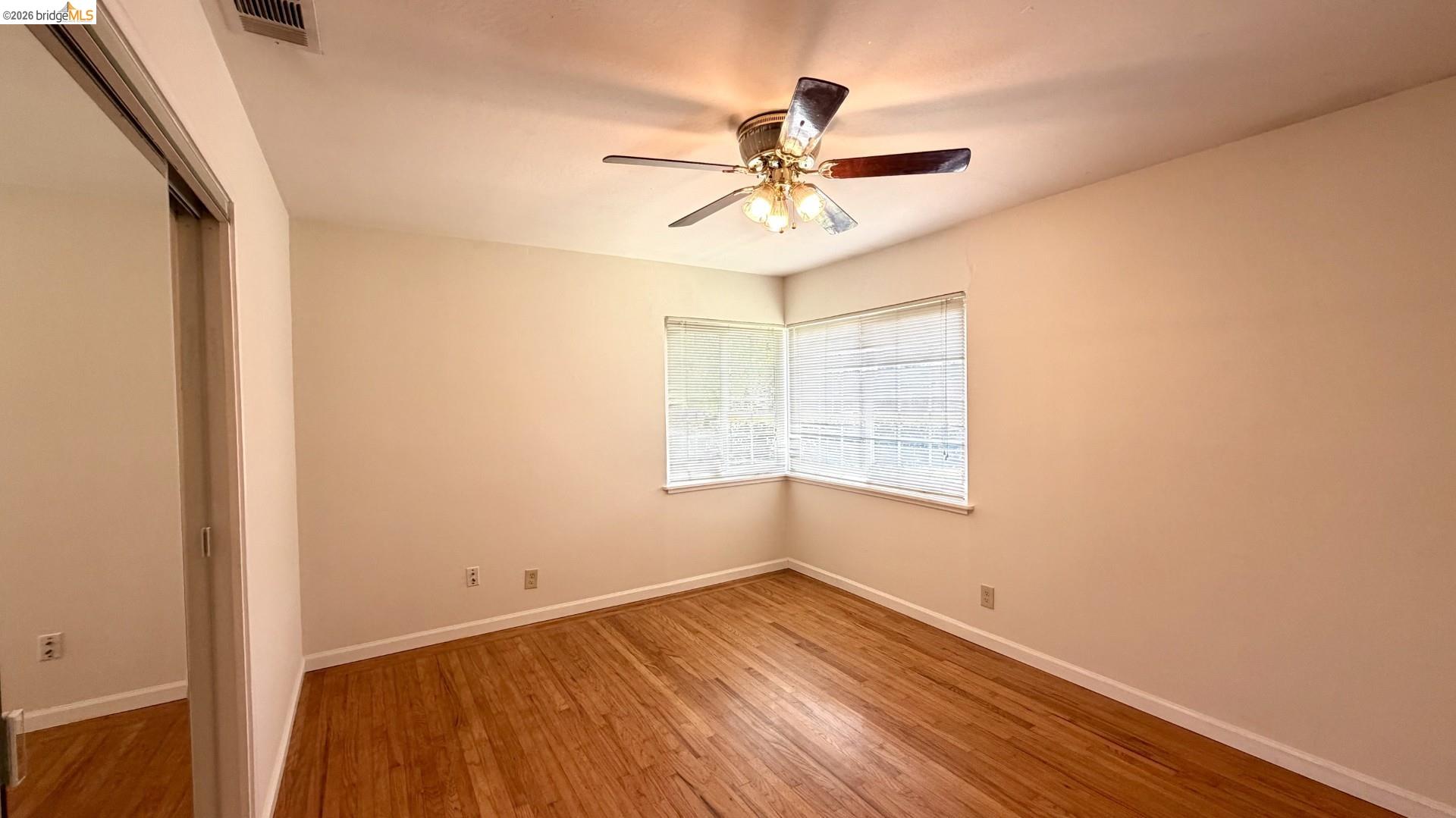3407 Cowell Road Concord, CA 94518 - Photo 6 of 24 Unfurnished bedroom featuring a closet, light wood-style floors, and a ceiling fan