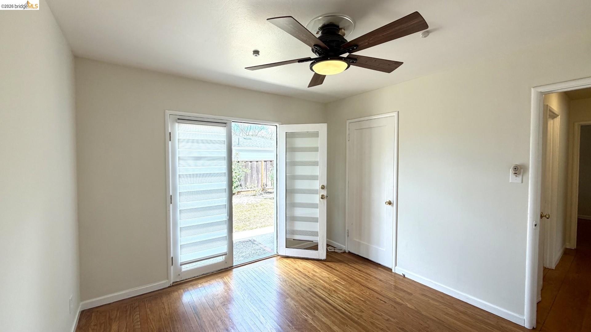 3407 Cowell Road Concord, CA 94518 - Photo 8 of 24 Unfurnished room featuring wood-type flooring and a ceiling fan
