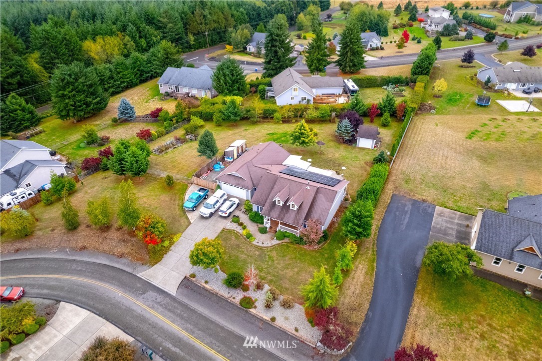 111 Garrett Loop Chehalis, WA 98532 - Photo 33 of 36 an aerial view of a house with a garden and lake view