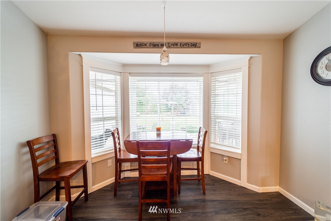 111 Garrett Loop Chehalis, WA 98532 - Photo 9 of 36 a view of a dining room with furniture window and wooden floor