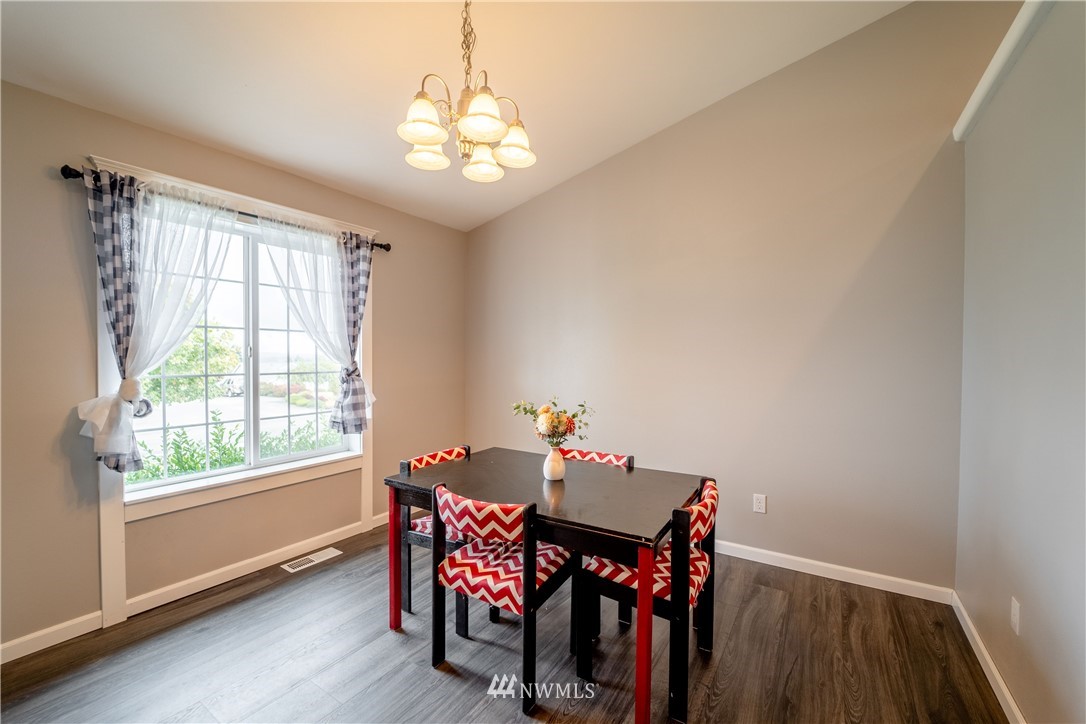 111 Garrett Loop Chehalis, WA 98532 - Photo 10 of 36 a view of a dining room with furniture window and outside view