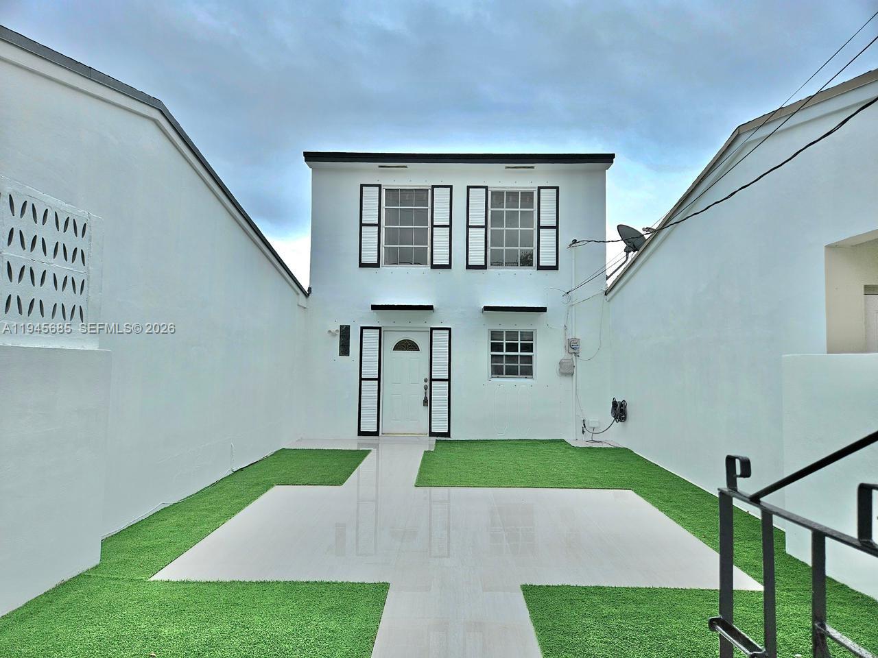 0 West Th Hialeah, FL 33014 - Photo 2 of 21 a view of house with yard