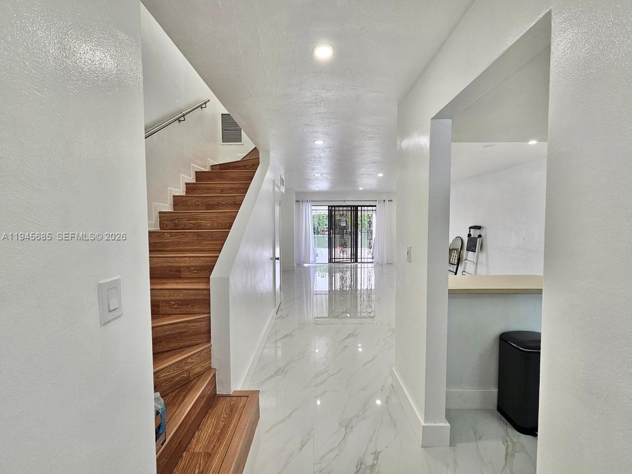 0 West Th Hialeah, FL 33014 - Photo 4 of 21 a view of entryway and hall with wooden floor