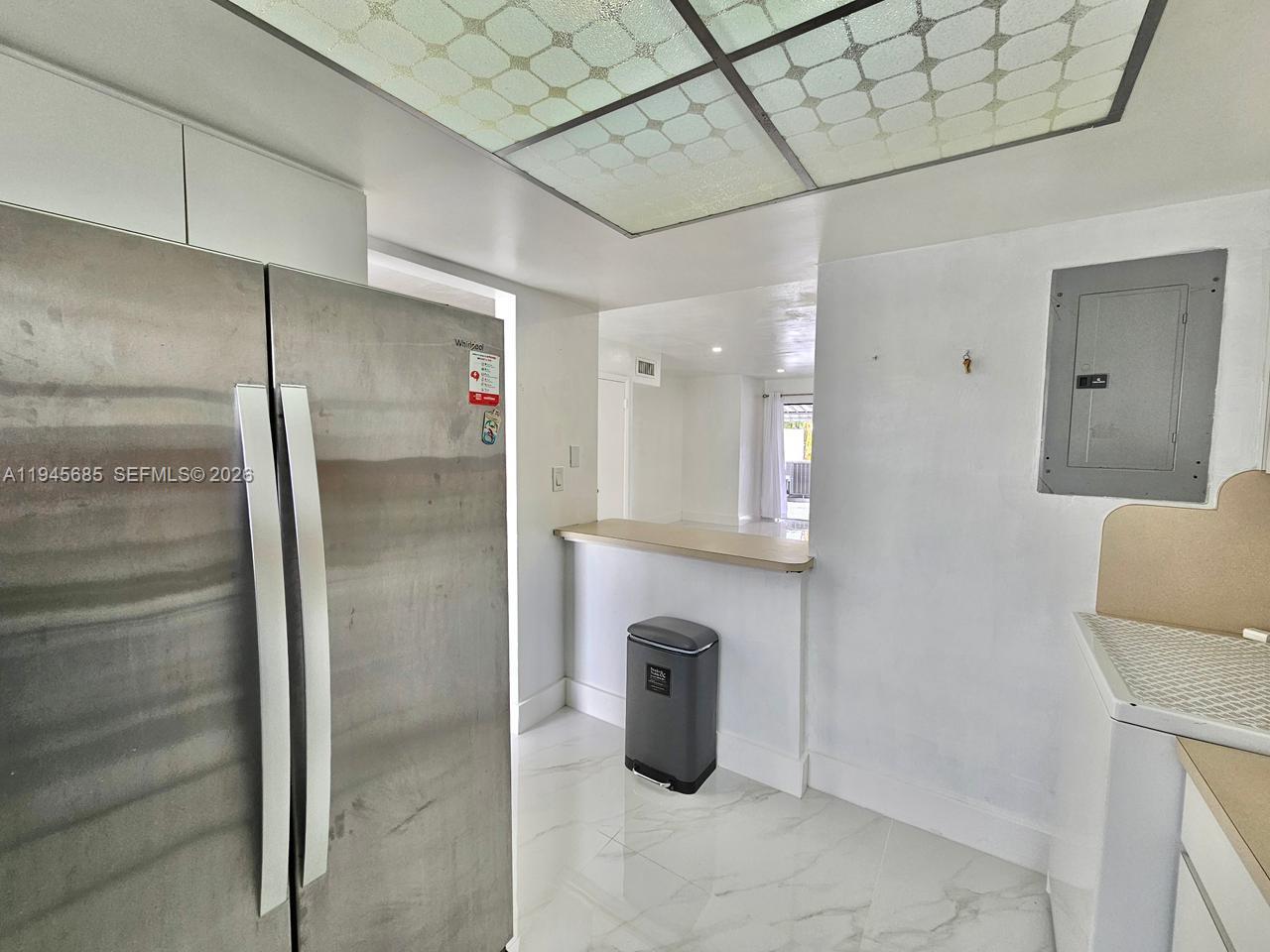 0 West Th Hialeah, FL 33014 - Photo 8 of 21 a bathroom with a mirror and a shower
