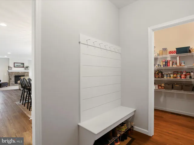 a shelf with cup and plates