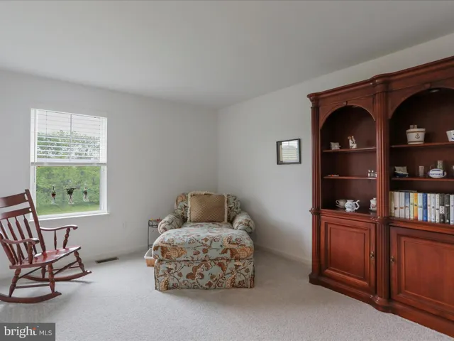a bathroom with a double vanity sink mirror and shower