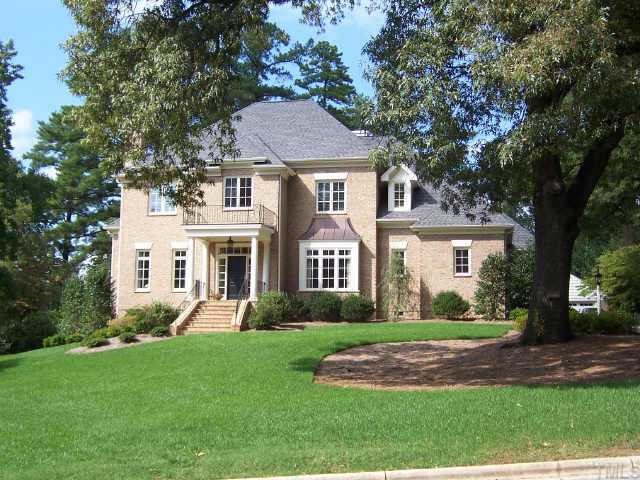 2722 Fairview Road Raleigh, NC 27608 - Photo 1 of 10 a front view of a house with a garden and trees