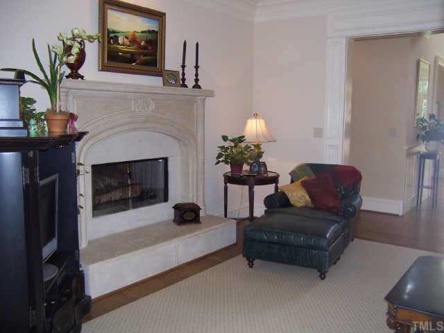 2722 Fairview Road Raleigh, NC 27608 - Photo 4 of 10 a living room with furniture and a fireplace