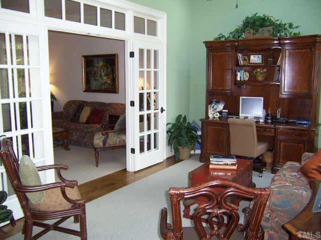 2722 Fairview Road Raleigh, NC 27608 - Photo 5 of 10 a view of a livingroom with furniture and a window