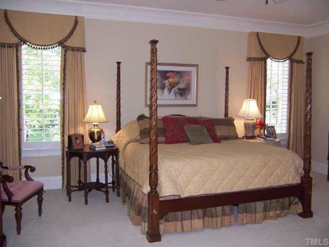 2722 Fairview Road Raleigh, NC 27608 - Photo 9 of 10 a bed room with a bed and a chair